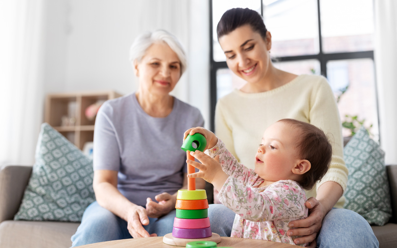 Grandmother, daughter, and granddaughter playing