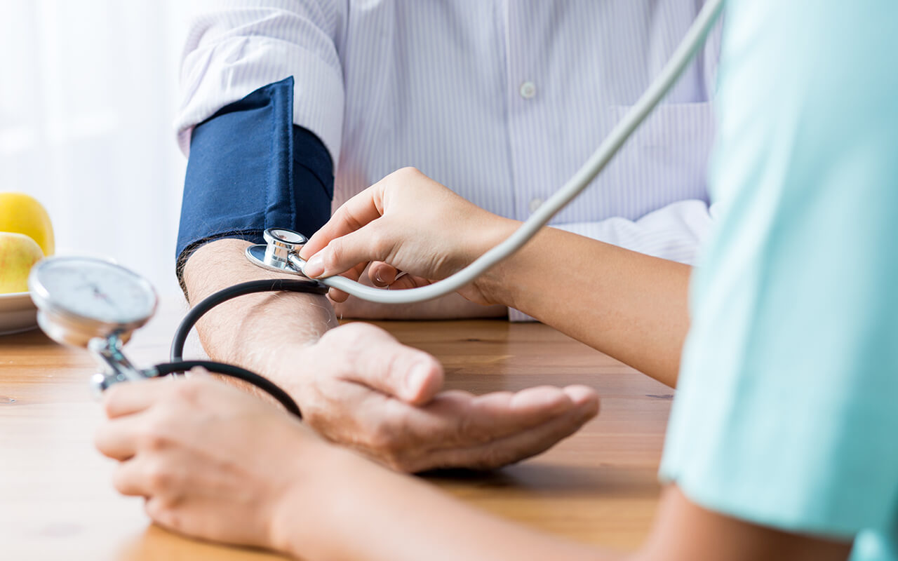 Person having blood pressure taken