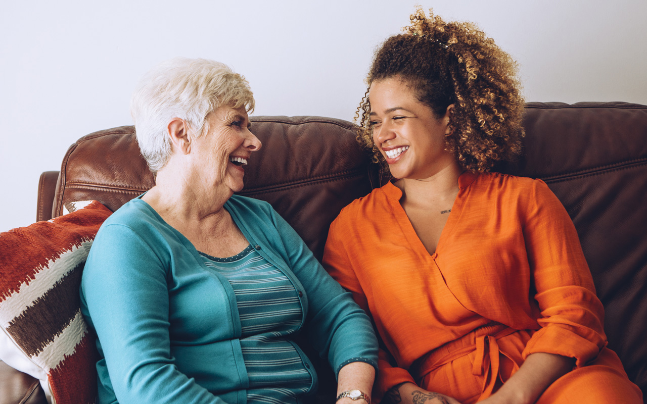 Older and younger woman on a couch