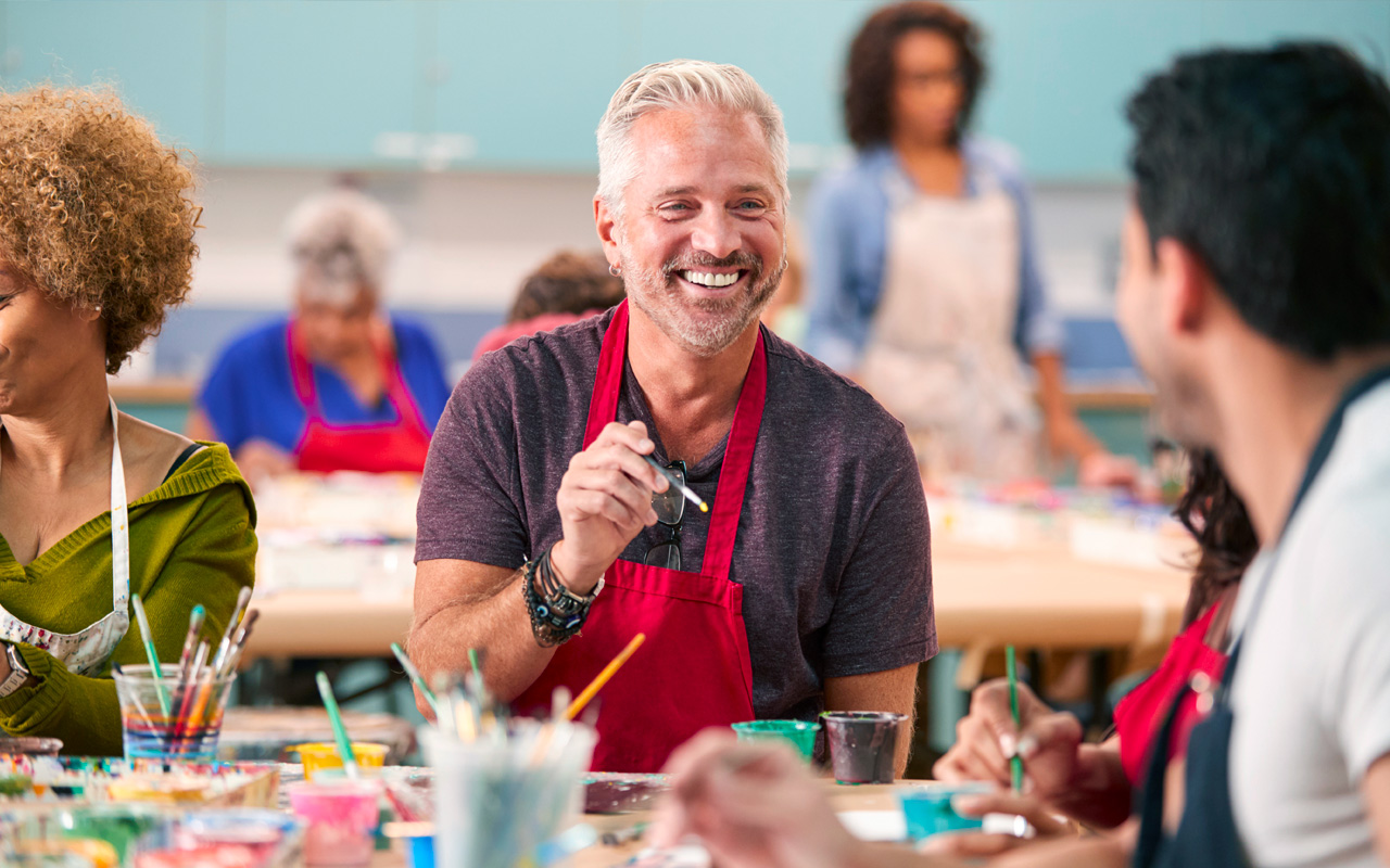 Man at painting class with friends