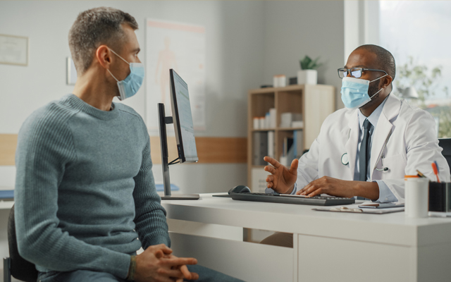 Masked doctor and patient