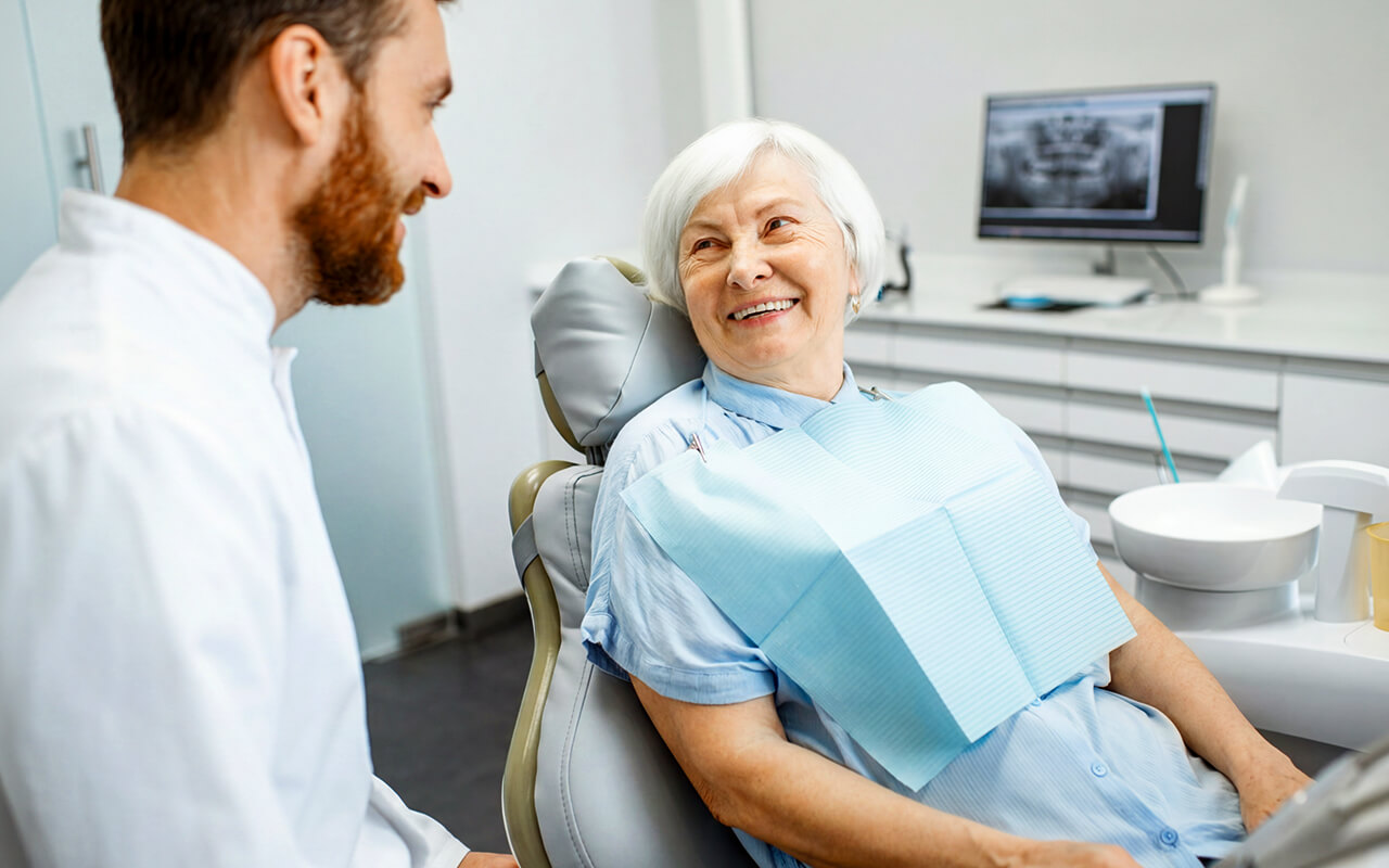 Woman sitting with her dentist