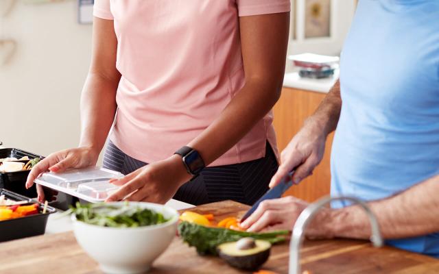 Couple preparing vegetables