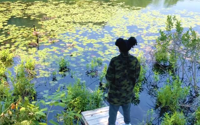 Olympic bowler GG Mason at a pond